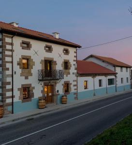 a row of buildings on the side of a road at OTERO DE CAMPOO in Espinilla