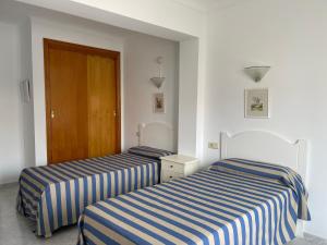 Posteľ alebo postele v izbe v ubytovaní Hostal CAN GALLU