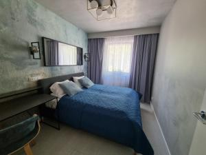 Posteľ alebo postele v izbe v ubytovaní M&K Apartament Bałtyk - Sobieszewo - Wyspa Sobieszewska
