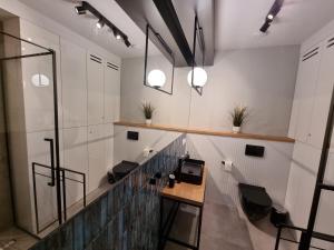 Televízia a/alebo spoločenská miestnosť v ubytovaní M&K Apartament Bałtyk - Sobieszewo - Wyspa Sobieszewska