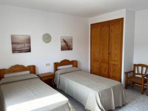 Posteľ alebo postele v izbe v ubytovaní Hostal CAN GALLU