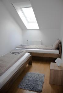 Postel nebo postele na pokoji v ubytování Csalogány Apartman
