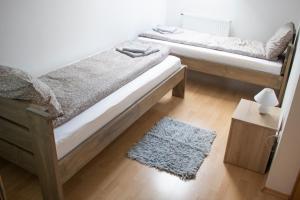 Postel nebo postele na pokoji v ubytování Csalogány Apartman