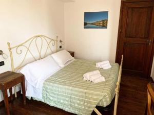 En eller flere senge i et værelse på Altopiano