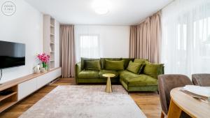 Televízia a/alebo spoločenská miestnosť v ubytovaní Apartamenty Good Time- Stone Hill II