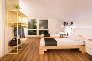 Postel nebo postele na pokoji v ubytování Gabanel Bike Hostel