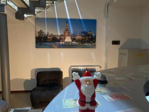 a stuffed animal sitting on a table in a room at HOTEL Poma in Milan