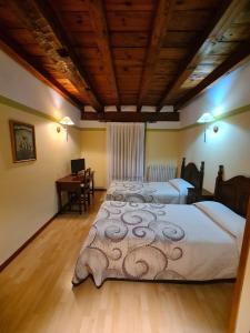 Postel nebo postele na pokoji v ubytování Hostal Las Nieves