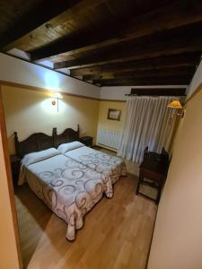 Postel nebo postele na pokoji v ubytování Hostal Las Nieves