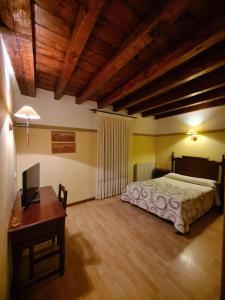 Postel nebo postele na pokoji v ubytování Hostal Las Nieves
