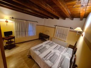 Postel nebo postele na pokoji v ubytování Hostal Las Nieves
