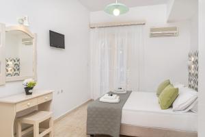 Postel nebo postele na pokoji v ubytování Pyrgaraki Studios and Apartments