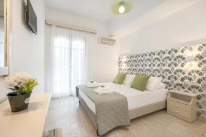 Postel nebo postele na pokoji v ubytování Pyrgaraki Studios and Apartments
