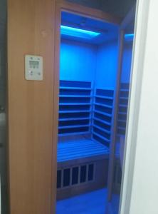 a room with blue lights in a closet at Apartmani Nikola in Vrnjačka Banja
