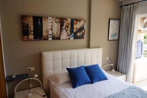 Łóżko lub łóżka w pokoju w obiekcie Apartamento Alcoy