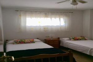 Łóżko lub łóżka w pokoju w obiekcie Apartamento Alcoy