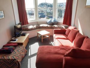 a living room with a couch and a table at Lammas Park House in Dawlish