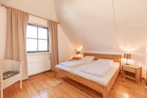 Postel nebo postele na pokoji v ubytování Buitenplaats Callantsoog