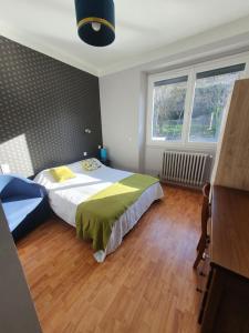 Postel nebo postele na pokoji v ubytování Chambre privée du Majestic