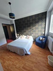 Postel nebo postele na pokoji v ubytování Chambre privée du Majestic