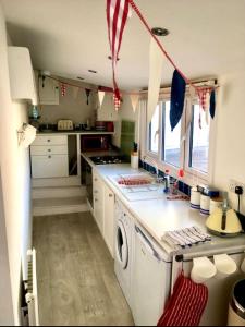a kitchen with an american flag hanging from the ceiling at Quirky Lyme Regis Apartment Near Beach in Lyme Regis
