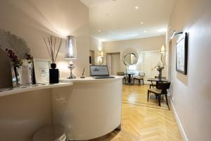 a living room with a counter with a laptop on it at Cardilli Luxury Rooms in Rome