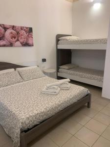 Ένα ή περισσότερα κρεβάτια σε δωμάτιο στο Bruco Holiday