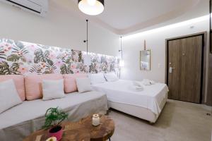 Postel nebo postele na pokoji v ubytování Loutraki Pinky Pearl