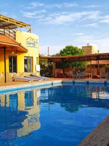 a large swimming pool in front of a building at Darna Divers Village in Aqaba