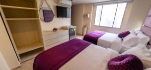 Postel nebo postele na pokoji v ubytování Trugo Luxury Rooms