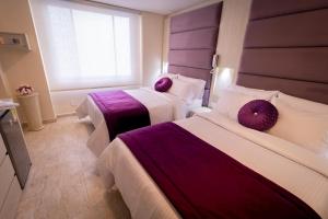 Postel nebo postele na pokoji v ubytování Trugo Luxury Rooms