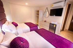 Postel nebo postele na pokoji v ubytování Trugo Luxury Rooms