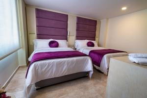 Postel nebo postele na pokoji v ubytování Trugo Luxury Rooms