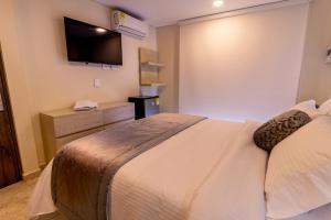 Postel nebo postele na pokoji v ubytování Trugo Luxury Rooms