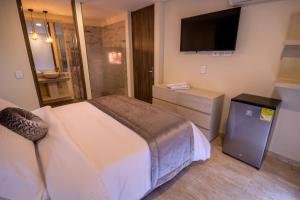 TV a/nebo společenská místnost v ubytování Trugo Luxury Rooms