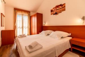 Posteľ alebo postele v izbe v ubytovaní Sunny beach apartment Lavica