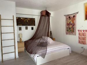 Кровать или кровати в номере Villa Naturiste Port Nature