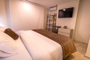 Postel nebo postele na pokoji v ubytování Trugo Luxury Rooms