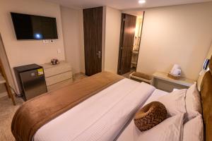 Postel nebo postele na pokoji v ubytování Trugo Luxury Rooms