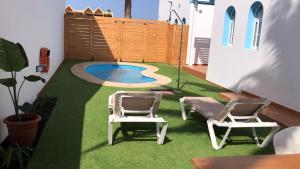 The swimming pool at or close to COZY, Beach House , by MAHBOVILLAS