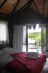 Cama ou camas em um quarto em Pousada Paradiso Tropical