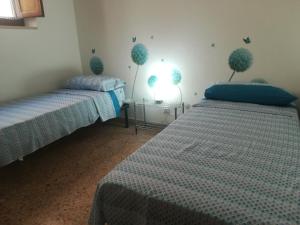 A bed or beds in a room at VillAmar