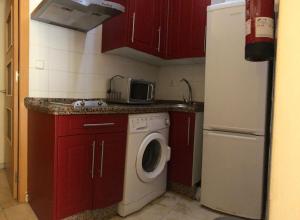 Kuchyňa alebo kuchynka v ubytovaní APARTAMENTOS HÉRCULES SEVILLA centro de Sevilla