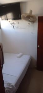 Giường trong phòng chung tại Hotel Tamaca Real