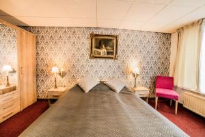Postel nebo postele na pokoji v ubytování Hotel Le Provencal