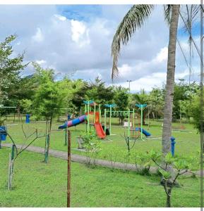 a park with a playground with a slide at GUESTHOUSE #1 SEMI Bungalow House in Kuah