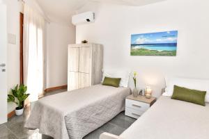 Postel nebo postele na pokoji v ubytování Residence Chiaro di Luna