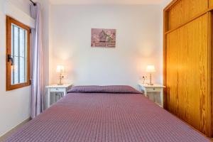 Ένα ή περισσότερα κρεβάτια σε δωμάτιο στο Altea Apartamento