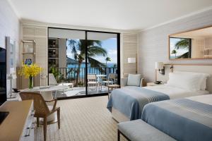 Postel nebo postele na pokoji v ubytování Halekulani - NO RESORT FEE