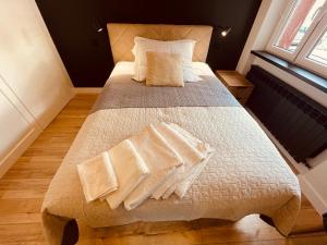 Posteľ alebo postele v izbe v ubytovaní Apartamenty KTW Park Śląski
